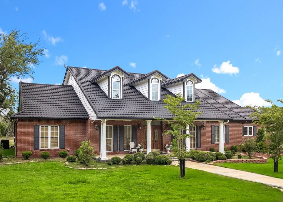 Modern dark roof tiles installed on a hip roof in Orlando, FL